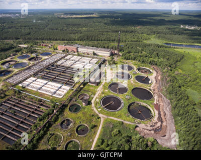 Area of water treatment plant with round settling and sedimentation tanks. Aerial view from drone Stock Photo