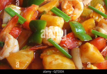 Sweet and sour shrimps with pineapple Stock Photo
