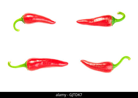 Four ripe red Chilli peppers on over white Stock Photo