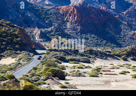 Cars driving on the highway TF-21, leading from the Teide volcano to the south coast of Tenerife. Canary Islands, Spain Stock Photo