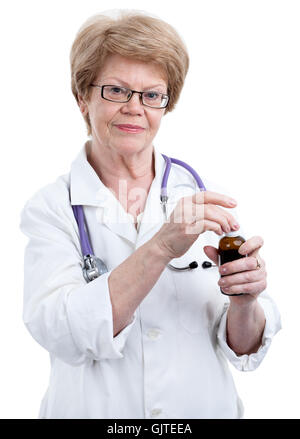 Caucasian female doctor in eyeglasses opening drug bottle, isolated on white background Stock Photo