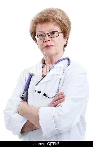 Portrait of serious mature woman in doctor uniform with clasped arms, looking at camera, isolated on white background Stock Photo