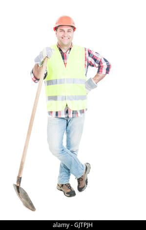 Smiling construction worker with helmet and shovel getting ready for work isolated on white background Stock Photo