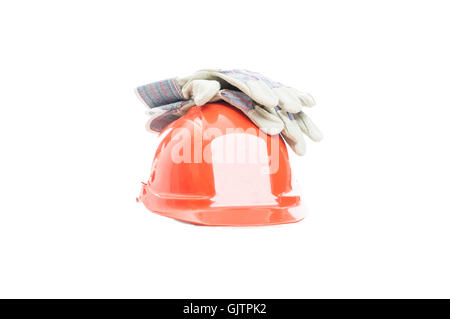 Safety gear kit with helmet and gloves for construction activity isolated on white background Stock Photo