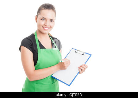 Attractive employee working in supermarket and holding clipboard while counting the stock isolated on white background with text Stock Photo