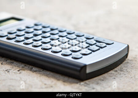 An old finance calculator on a table. Stock Photo