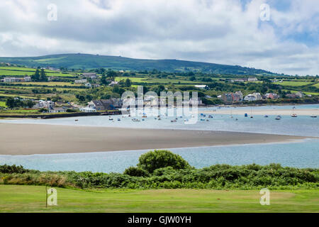 View across golf course and Afon Nyfer river estuary to Newport Sands and village at high tide. Newport Pembrokeshire Wales UK Stock Photo