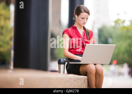 woman skirt laptop Stock Photo