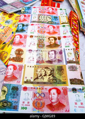 Anyang, Anyang, China. 17th Aug, 2016. Anyang, CHINA- August 16 2016: (EDITORIAL USE ONLY. CHINA OUT) False paper money at the market of offering. Various weird offerings including fake iPhones, villas, false paper money and cigarettes are on sale in Hua County, central ChinaÂ¡Â¯s Henan Province, before the traditional Zhongyuan Festival comes. Chinese traditional Zhongyuan Festival, also known as Ghost Festival, is celebrated on 15th day of the seventh lunar month. People usually burn incense and paper money as an offering to the spirits of deceased ancestors during the festival. (Credit I Stock Photo