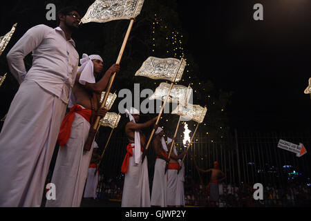 Kandy, Sri Lanka. 17th Aug, 2016. Sri Lankan Kandyan dancers take part in a procession during the Esala Perahera festival in Kandy, some 116 km from Colombo, Sri Lanka, on Aug. 17, 2016. The ten-day festival has a great parade presented on Wednesday night, featuring Kandyan dancers, fire twirlers, traditional musicians, acrobatic fire performers and elephants, which draw thousands of tourists and spectators around the island. Credit:  A. Rjhitha/Xinhua/Alamy Live News Stock Photo