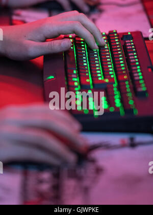 Cologne, Germany. 18th Aug, 2016. A visitor at a keyboard at the Gamescom gaming convention in Cologne, Germany, 18 August 2016. The Gamescom gaming convention runs from 17-21 August 2016. PHOTO: MARIUS BECKER/DPA/Alamy Live News Stock Photo