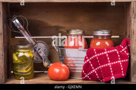 Home canned vegetables in jars with old mixer Stock Photo