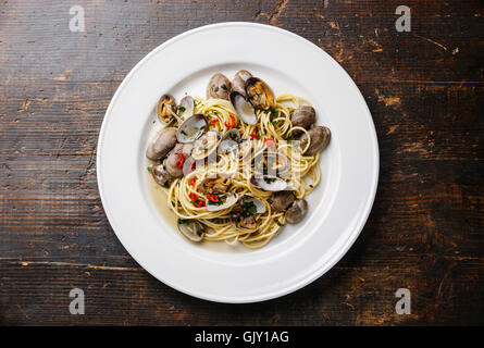 Spaghetti alle Vongole Seafood pasta with clams on white plate Stock Photo