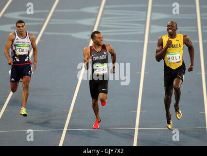 Great Britain's Adam Gemili (left), Canada's Andre de Grasse (centre) and Jamaica's Usain Bolt in action during the Men's 200m semi-final at Olympic Stadium on the twelfth day of the Rio Olympic Games, Brazil. Stock Photo