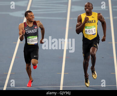 Canada's Andre De Grasse (left) and Jamaica's Usain Bolt compete in the second Men's 200m semi final at the Olympic Stadium on the twelfth day of the Rio Olympic Games, Brazil. Picture date: Wednesday August 17, 2016. Photo credit should read: Mike Egerton/PA Wire. Stock Photo