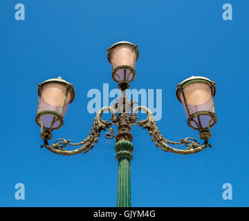Venetian street light against a blue sky. Venice,Italy. Stock Photo