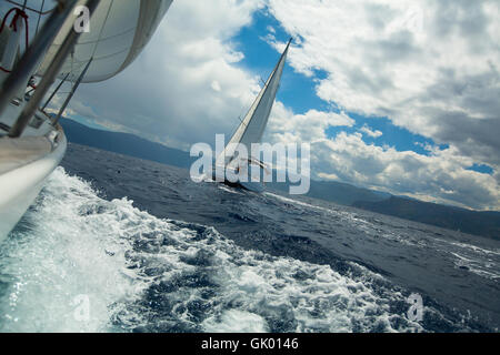 Sailing over the ocean waves in stormy weather. Stock Photo