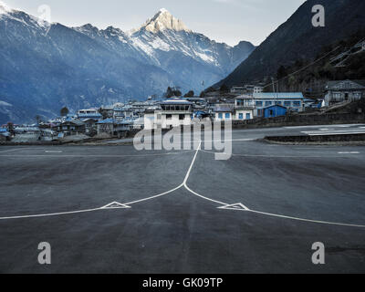 A runway at the Lukla Airport in Lukla, Nepal, which is a gateway to Everest Base Camp. Stock Photo