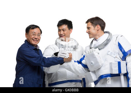 Studio shot male astronauts and engineers Stock Photo