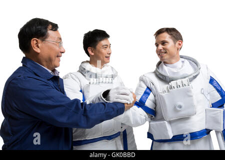 Studio shot male astronauts and engineers Stock Photo