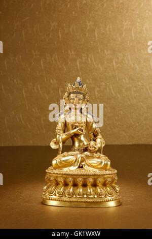 Gilt copper Buddha image Stock Photo