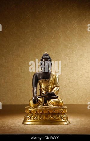 Gilt copper Buddha image Stock Photo