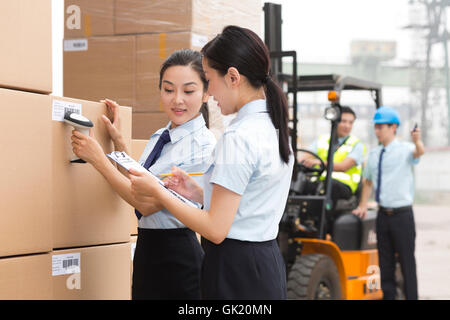 Logistics warehouse management personnel inspect the goods Stock Photo