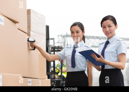 Logistics warehouse management personnel inspect the goods Stock Photo