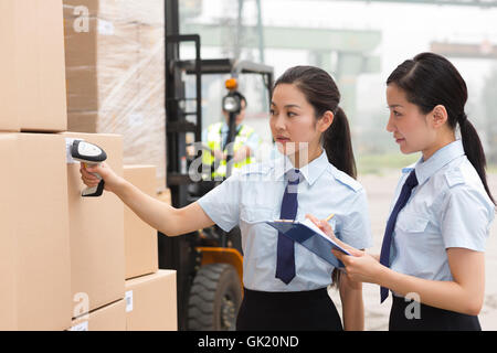 Logistics warehouse management personnel inspect the goods Stock Photo