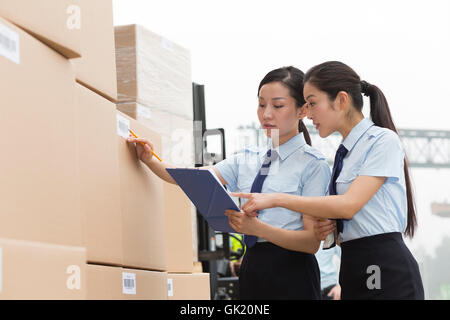 Logistics warehouse management personnel inspect the goods Stock Photo