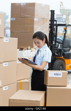 Logistics warehouse management personnel inspect the goods Stock Photo