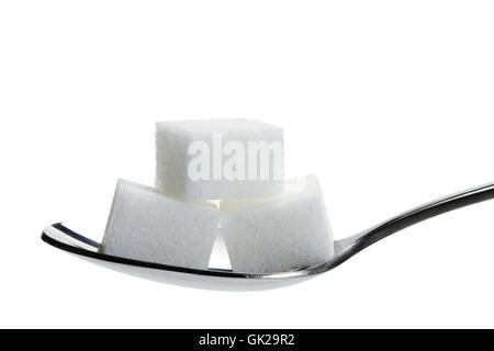 three sugar cubes on a spoon Stock Photo