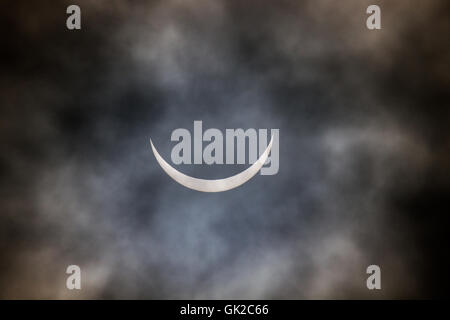 Solar eclipse, Manchester, UK on 20th March 2015. Photographed on a cloudy day over the United Kingdom. Stock Photo
