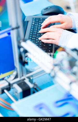 cnc router machine programming on computer keyboard Stock Photo