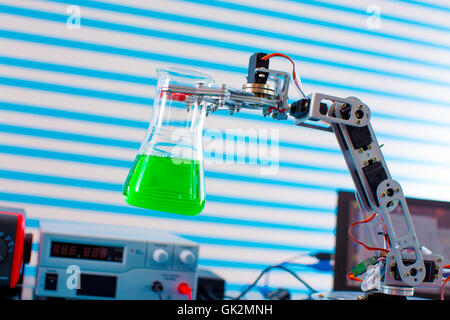 Flask in roboter arm Stock Photo