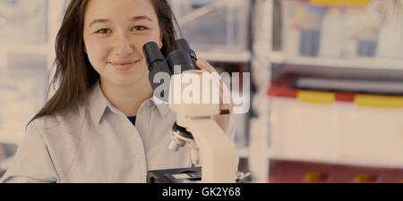 Teen girl in laboratory classes, banner horizontal format with free copyspace Stock Photo