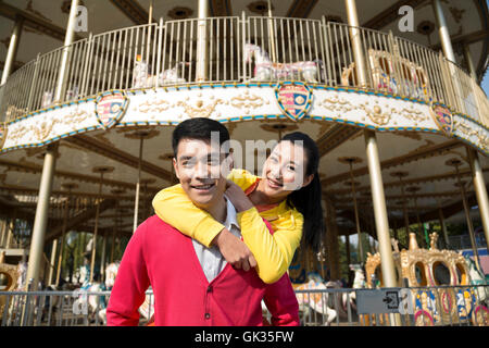 Young couple went to the amusement park Stock Photo