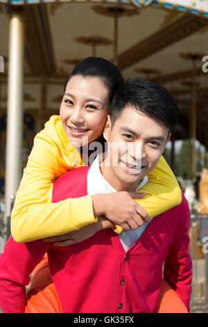 Young couple went to the amusement park Stock Photo