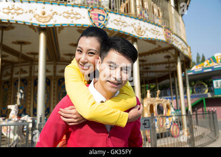 Young couple went to the amusement park Stock Photo