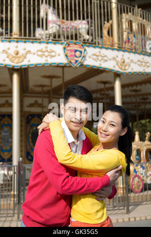 Young couple went to the amusement park Stock Photo