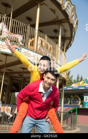 Young couple went to the amusement park Stock Photo