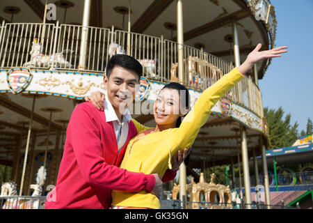 Young couple went to the amusement park Stock Photo