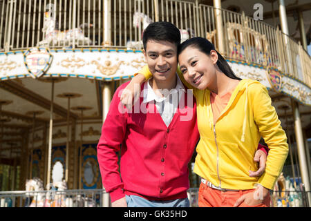 Young couple went to the amusement park Stock Photo