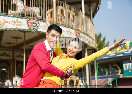 Young couple went to the amusement park Stock Photo