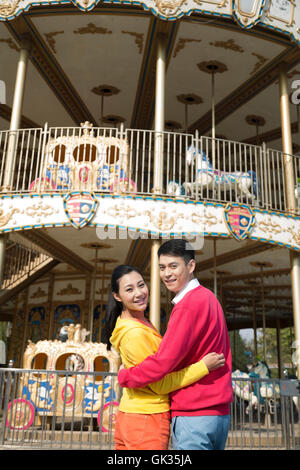 Young couple went to the amusement park Stock Photo