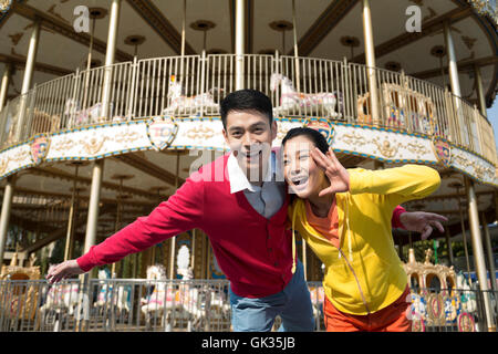 Young couple went to the amusement park Stock Photo