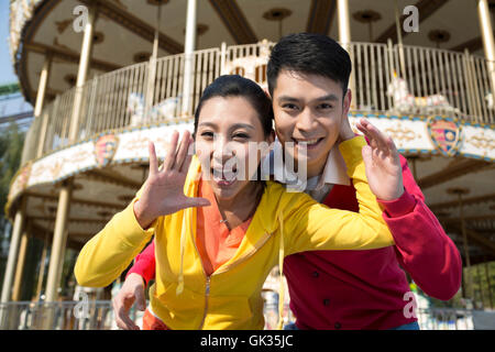 Young couple went to the amusement park Stock Photo