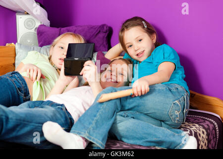 children playing with game console Stock Photo