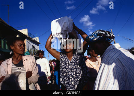 ca. 2000, Antananarivo, Madagascar --- A Woman Holding the Coffin of Her Dead Child During Famadihana --- Image by © Jeremy Horn Stock Photo