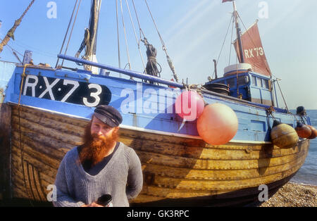Hastings old town fisherman beside his boat. Sussex. England. UK Stock Photo